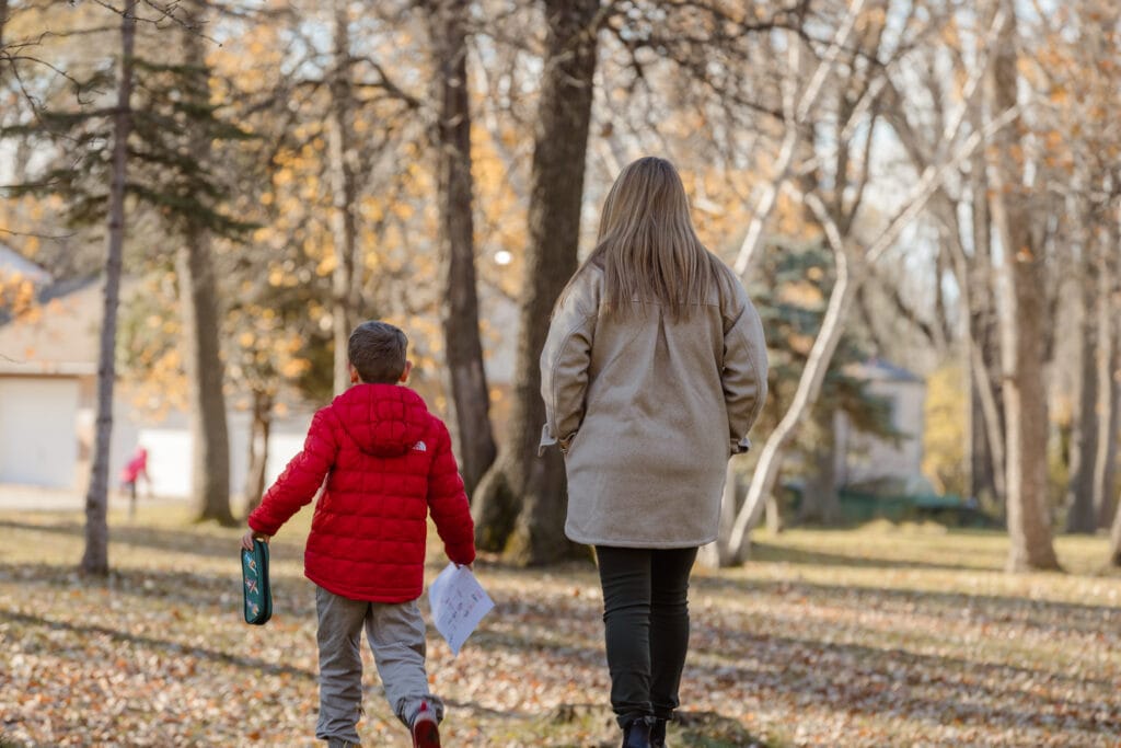 female teacher and kid on campus